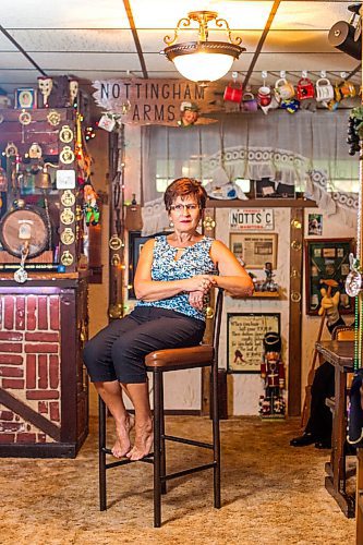 MIKAELA MACKENZIE / WINNIPEG FREE PRESS

Travel agent Christine Ward poses for a portrait in the British pub in her basement (where she often brings clients for meetings) in Winnipeg on Thursday, Sept. 3, 2020. She's been running her otherwise thriving business at a loss because of COVID-19. For Temur story.
Winnipeg Free Press 2020.