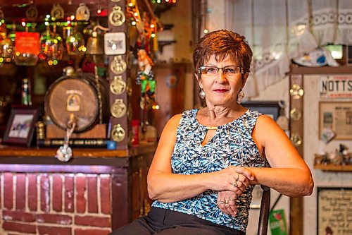 MIKAELA MACKENZIE / WINNIPEG FREE PRESS

Travel agent Christine Ward poses for a portrait in the British pub in her basement (where she often brings clients for meetings) in Winnipeg on Thursday, Sept. 3, 2020. She's been running her otherwise thriving business at a loss because of COVID-19. For Temur story.
Winnipeg Free Press 2020.