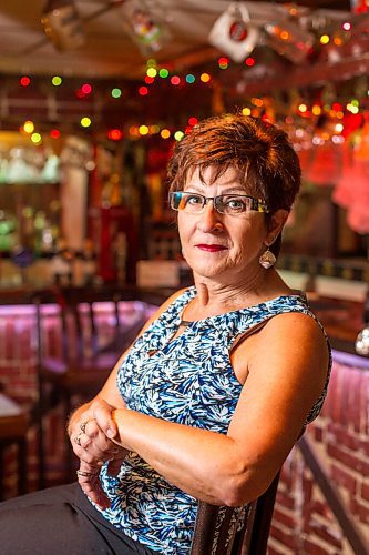 MIKAELA MACKENZIE / WINNIPEG FREE PRESS

Travel agent Christine Ward poses for a portrait in the British pub in her basement (where she often brings clients for meetings) in Winnipeg on Thursday, Sept. 3, 2020. She's been running her otherwise thriving business at a loss because of COVID-19. For Temur story.
Winnipeg Free Press 2020.