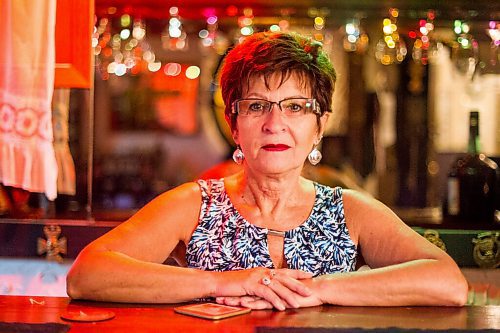 MIKAELA MACKENZIE / WINNIPEG FREE PRESS

Travel agent Christine Ward poses for a portrait in the British pub in her basement (where she often brings clients for meetings) in Winnipeg on Thursday, Sept. 3, 2020. She's been running her otherwise thriving business at a loss because of COVID-19. For Temur story.
Winnipeg Free Press 2020.