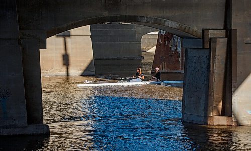 MIKE DEAL / WINNIPEG FREE PRESS
Rowers make their way along the Red River under the Norwood Bridge Thursday morning.
200903 - Thursday, September 03, 2020.