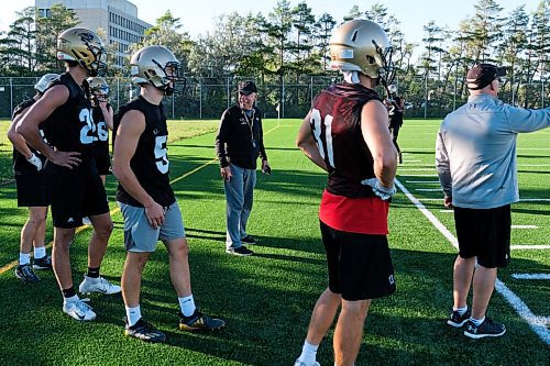 Daniel Crump / Winnipeg Free Press. University of Manitoba Bisons football team coach Brian Dobie and and players as they run a drill during practice at the university. September 3, 2020.