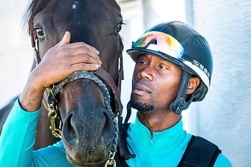 MIKAELA MACKENZIE / WINNIPEG FREE PRESS

Trainer Devon Gittens and horse Purrsistent pose for a portrait at the Assiniboia Downs backstretch in Winnipeg on Friday, Sept. 4, 2020. For George Williams story.
Winnipeg Free Press 2020.