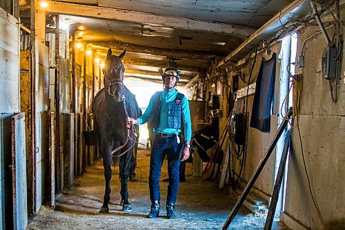 MIKAELA MACKENZIE / WINNIPEG FREE PRESS

Trainer Devon Gittens and horse Purrsistent pose for a portrait at the Assiniboia Downs backstretch in Winnipeg on Friday, Sept. 4, 2020. For George Williams story.
Winnipeg Free Press 2020.