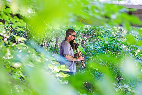 MIKAELA MACKENZIE / WINNIPEG FREE PRESS

Dave Nazgul plays a flute under the pedestrian bridge, where the music floats up to walkers above, at Assiniboine Park in Winnipeg on Friday, Sept. 4, 2020. Standup.
Winnipeg Free Press 2020.