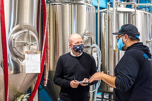 MIKAELA MACKENZIE / WINNIPEG FREE PRESS

Reporter Ben Sigurdson interviews brewery owner Andrew Sookram at Sookram's brewery in Winnipeg on Friday, Sept. 4, 2020. Sookram's is one of many local breweries with mandatory mask policies. For marketing.
Winnipeg Free Press 2020.