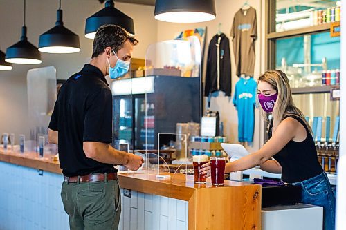 MIKAELA MACKENZIE / WINNIPEG FREE PRESS

Nathaniel Thevrien orders beers from Hailey Breland at Sookram's brewery in Winnipeg on Friday, Sept. 4, 2020. Sookram's is one of many local breweries with mandatory mask policies. For Ben Sigurdson story.
Winnipeg Free Press 2020.