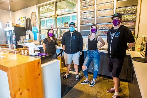 MIKAELA MACKENZIE / WINNIPEG FREE PRESS

Natalia Gala (left), Andrew Sookram, Colin Enquist, and Hailey Breland pose for a photo in their matching masks at Sookram's brewery in Winnipeg on Friday, Sept. 4, 2020. Sookram's is one of many local breweries with mandatory mask policies. For Ben Sigurdson story.
Winnipeg Free Press 2020.