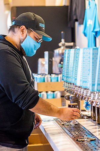 MIKAELA MACKENZIE / WINNIPEG FREE PRESS

Andrew Sookram pours some beers at Sookram's brewery in Winnipeg on Friday, Sept. 4, 2020. Sookram's is one of many local breweries with mandatory mask policies. For Ben Sigurdson story.
Winnipeg Free Press 2020.