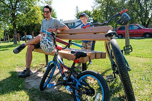 Daniel Crump / Winnipeg Free Press. Matt Ullenbloom and his son Owen Ullenbloom stop to play at a playground on Vialoux Drive. Five-year-old Owen has been learning to ride a bike this summer. September 5, 2020.