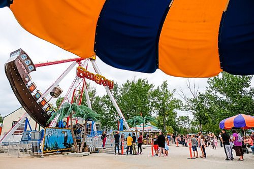 Daniel Crump / Winnipeg Free Press. People wait in line at Tinkertown for the Sea Ray ride. Sunday is the final day of Tinkertown's shortened season. September 5, 2020.