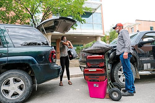 Daniel Crump / Winnipeg Free Press. Todd Mazur (right) helps his daughter, Emily Mazur (left), move into her room at the Pembina Hall residence at the University of Manitoba. Along with standard safety precautions, such as wearing a mask and physical distancing, residents are only allowed to have one other person help them move belongings into their dorms.Emily, who is from Fischer Branch, is starting her first year of university and says while she is a little nervous she doesnt want to let that stop her pursuing a science degree. September 5, 2020.