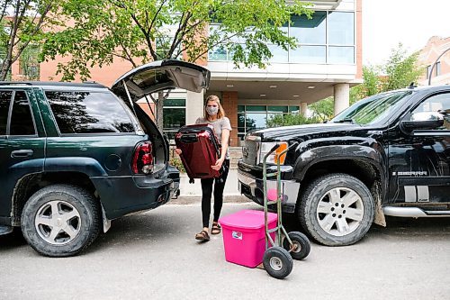 Daniel Crump / Winnipeg Free Press. Emily Mazur unpacks her belonging from the family car as she prepares to move into her room at the Pembina Hall residence at the University of Manitoba. Along with standard safety precautions, such as wearing a mask and physical distancing, residents are only allowed to have one other person help them move belongings into their dorms.Emily, who is from Fischer Branch, is starting her first year of university and says while she is a little nervous she doesnt want to let that stop her pursuing a science degree. September 5, 2020.
