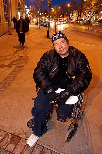 BORIS.MINKEVICH@FREEPRESS.MB.CA BORIS MINKEVICH/ WINNIPEG FREE PRESS  091123 Ronald Courchene poses for a photo in his wheelchair on Main Street in front of the Sally Ann.