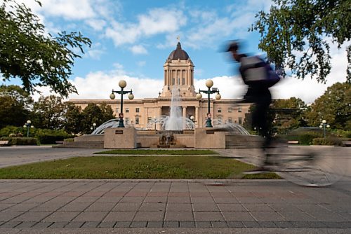 JESSE BOILY  / WINNIPEG FREE PRESS
A cyclist rides past the Legislative grounds on Tuesday. Tuesday, Sept. 8, 2020.
Reporter: Standup