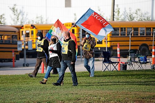 Winnipeg school bus drivers and supporters picket outside the Winnipeg School Division bus depot in Winnipeg Wednesday, September 9, 2020. Bus drivers hit the picket lines this morning. THE CANADIAN PRESS/John Woods