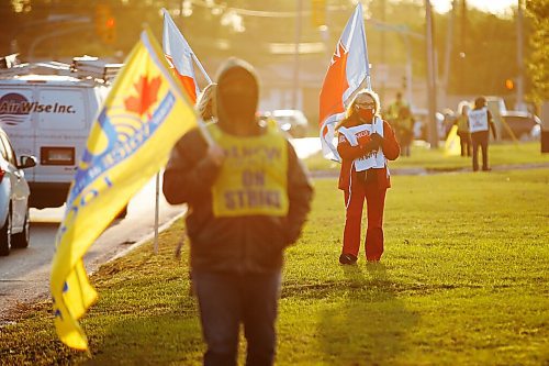 Winnipeg school bus drivers and supporters picket outside the Winnipeg School Division bus depot in Winnipeg Wednesday, September 9, 2020. Bus drivers hit the picket lines this morning. THE CANADIAN PRESS/John Woods