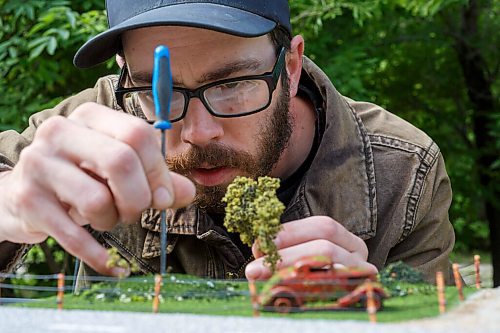 MIKE DEAL / WINNIPEG FREE PRESS
Dan fixes a tree in a diorama that includes a '34 Ford. 
Daniel Walker, a member of 204HotWheels, a local group devoted to Hot Wheels cars (about 600 members in the city). What sets Daniel apart from the rest is that besides collecting cars, he also has gotten into customizing Hot Wheels, swapping out tires, inserting engines, and repainting. He also makes small dioramas turning Hot Wheel cars into old rusted cars that look like they have been abandoned in a field.
200909 - Wednesday, September 09, 2020.