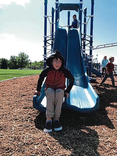 Canstar Community News Caden Warren tries out the new slide while Zander Drake waits his turn. (SHELDON BIRNIE/CANSTAR/THE HERALD)