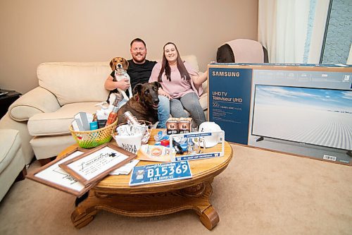 Mike Sudoma / Winnipeg Free Press
Bethany Trapp and her fiancé Tyler Hebel sit with behind a few of their wedding social prizes with their dogs Freya (left) and Barkley (right). The couple is now on their third tentative date for their wedding social as CoVid pandemic restrictions have altered their wedding plans for this year.
September 9, 2020