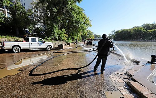RUTH BONNEVILLE / WINNIPEG FREE PRESS

STANDUP - RIVERWALK CLEANUP 

City of Winnipeg crews power wash the river walk along the Assiniboine River on Thursday morning after high river levels throughout the summer overflowed its banks leaving behind hardened, clay-like mud along the pathway.  

Sept 10th, 2020