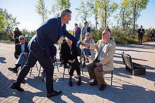 MIKE DEAL / WINNIPEG FREE PRESS
Bumping fists with members of the Enns family prior to making an announcement at Oak Hammock Marsh Interpretive Centre Thursday morning.
Premier Brian Pallister announced that the Manitoba government has established a $6 million endowment with the Interlake Community Foundation to support the Oak Hammock Marsh Interpretive Centre, which has now been renamed the Harry J. Enns Wetland Discovery Centre by Ducks Unlimited Canada.
200910 - Thursday, September 10, 2020.