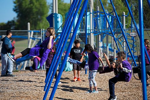 MIKE DEAL / WINNIPEG FREE PRESS
One of the Linden Meadows grade 5-6 cohorts wear purple on the playground during recess Friday morning.
Linden Meadows school has assigned cohorts colours and is requiring students to clothing in a specific shade so teachers can tell groups apart and redirect students if they get mixed up on the playground. 
See Maggie story
200911 - Friday, September 11, 2020.