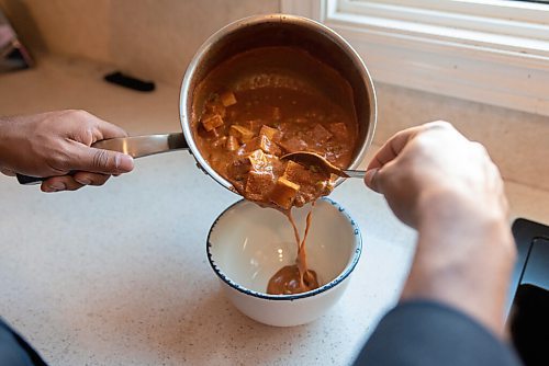 JESSE BOILY  / WINNIPEG FREE PRESS
Ashish Selvanathan, owner of Cheeky Foods, pours some of his butter chicken at his mothers kitchen on Friday. Friday, Sept. 11, 2020.
Reporter: Dave Sanderson