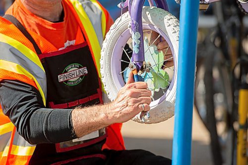 Mike Sudoma / Winnipeg Free Press
Wrench volunteer, Curt Hull, works to repair a childs bike during the Wrenchs, Bike Build-A-Thon held at the Brady Land Fill Saturday morning.
September 12, 2020