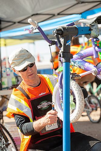 Mike Sudoma / Winnipeg Free Press
Wrench volunteer, Curt Hull, works to repair a childs bike during the Wrenchs, Bike Build-A-Thon held at the Brady Land Fill Saturday morning.
September 12, 2020