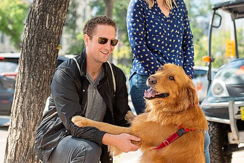 Mike Sudoma / Winnipeg Free Press
Jason Macloud and his pup Rorie share a moment as they listen to their friend Gar Gach perform along Broadway St during Minifest Saturday afternoon
September 12, 2020