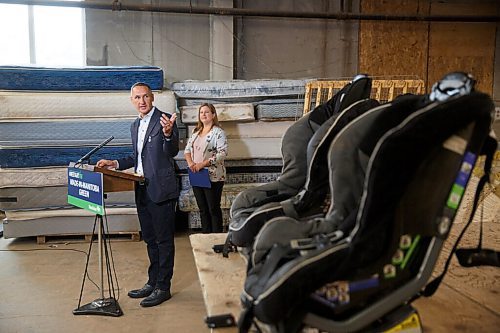 MIKE DEAL / WINNIPEG FREE PRESS
Kevin Chief, director, Centre for Aboriginal Human Resource Development Inc. gestures to a couple child car seats while talking after Conservation and Climate Minister Sarah Guillemard announced that the Manitoba government is going to provide $10 million toward recycling and waste diversion during the COVID-19 pandemic at a news conference at Mother Earth Recycling, 771 Main Street, Monday morning. 
Mother Earth Recycling is going to start exploring the possibility of recycling car seats.
See Ben Waldman story
200914 - Monday, September 14, 2020.