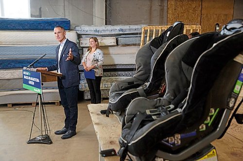 MIKE DEAL / WINNIPEG FREE PRESS
Kevin Chief, director, Centre for Aboriginal Human Resource Development Inc. gestures to a couple child car seats while talking after Conservation and Climate Minister Sarah Guillemard announced that the Manitoba government is going to provide $10 million toward recycling and waste diversion during the COVID-19 pandemic at a news conference at Mother Earth Recycling, 771 Main Street, Monday morning. 
Mother Earth Recycling is going to start exploring the possibility of recycling car seats.
See Ben Waldman story
200914 - Monday, September 14, 2020.