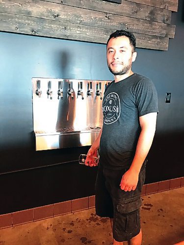 Canstar Community News Oxus Brewing Company brewmaster Sean Shoyoqubov pictured in his tap room at 1180 Sanford Street.
