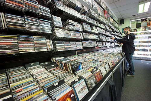 MIKE DEAL / WINNIPEG FREE PRESS
Store manager, Cathie Stankey, organizes some CD's.
Planet of Sound, 201-1109 Henderson Hwy, an entertainment emporium celebrating its 20th anniversary this year. When Dave Wright started the store in 2000, it was primarily CDs, DVDs and VHS tapes. Vinyl joined the party about 10 years ago and are now a big part of sales.
see Dave Sanderson story
200915 - Tuesday, September 15, 2020.