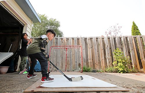 RUTH BONNEVILLE / WINNIPEG FREE PRESS

49.8 - school families

Photo of MJ Patrick-Prieston learning how to use a hockey stick outside home in Silver Heights Tuesday. Carter Parenteau (black shirt -  Grade 4, 9yrs), waits his turn next to him. 

Story: The Parenteaus are collaborating inside their close family bubble so their children have numerous teachers (In a way, it's both the Parenteau-Kennedy family). They've chosen to homeschool while still remaining enrolled in the Ojibwe bilingual program at Isaac Brock so they don't lose their spot. Their concerns include the health of the elders around them and their family members with diabetes and other underlying health concerns. 


Reporter - Maggie 

Sept 15th, 2020