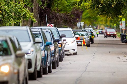 MIKAELA MACKENZIE / WINNIPEG FREE PRESS

Traffic lines up down multiple blocks of Charles Street for COVID-19 drive-through testing in Winnipeg on Thursday, Sept. 17, 2020. For Danielle story.
Winnipeg Free Press 2020.