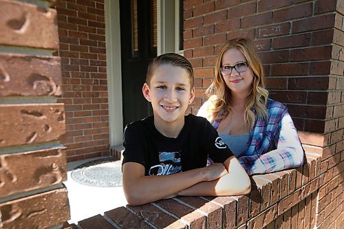 JOHN WOODS / WINNIPEG FREE PRESS
John Pritchard School grade 6 student Connor Gylywoychuk, who does not have COVID-19, and his mother Breanne are photographed outside their home in Winnipeg Thursday, September 17, 2020. Gylywoychuks son was sent home from school as a precaution when a grade 7 student was found to be COVID-19 positive.

Reporter: Abas