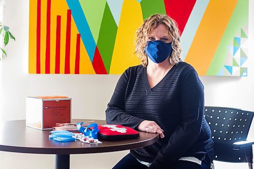 MIKAELA MACKENZIE / WINNIPEG FREE PRESS

Tammy Reimer poses for a portrait with naloxone kits and harm reduction supplies in her office at Nine Circles in Winnipeg on Friday, Sept. 18, 2020.  For Katie May story.

Winnipeg Free Press 2020