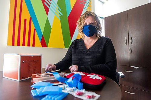 MIKAELA MACKENZIE / WINNIPEG FREE PRESS

Tammy Reimer poses for a portrait with naloxone kits and harm reduction supplies in her office at Nine Circles in Winnipeg on Friday, Sept. 18, 2020.  For Katie May story.

Winnipeg Free Press 2020