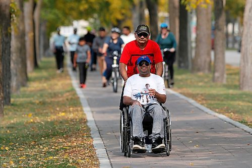 JOHN WOODS / WINNIPEG FREE PRESS
Chris Deo and his father Sunil walk in the Terry Fox Run/Walk in Assiniboine Park in Winnipeg Sunday, September 20, 2020. The Deos and other Cosmos Cricket Club players and family members walked 5km and raised about $1500 for Terry Fox Run/Walk.

Reporter: ?