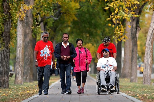 JOHN WOODS / WINNIPEG FREE PRESS
Ray Ramrattan,President of the Cosmos Cricket Club and cancer survivor, from left, Kris and Sandy Singh, and Chris Deo and his father Sunil walk in the Terry Fox Run/Walk in Assiniboine Park in Winnipeg Sunday, September 20, 2020. Ramrattan organized Cosmos Cricket Club players and family members to walk 5km and raised about $1500 for Terry Fox Run/Walk.

Reporter: ?
