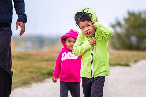 MIKAELA MACKENZIE / WINNIPEG FREE PRESS

Bishop Eugenio (three, front) and his sister, Veyda (two), go for a walk on a windy day at Westview Park in Winnipeg on Monday, Sept. 21, 2020.  Standup.

Winnipeg Free Press 2020