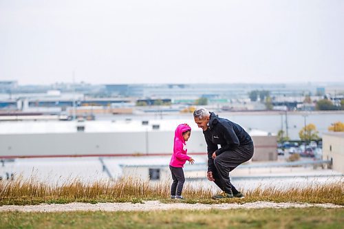 MIKAELA MACKENZIE / WINNIPEG FREE PRESS

Howie Eugenio and his daughter Veyda (two) go for a walk on a windy day at Westview Park in Winnipeg on Monday, Sept. 21, 2020.  Standup.

Winnipeg Free Press 2020