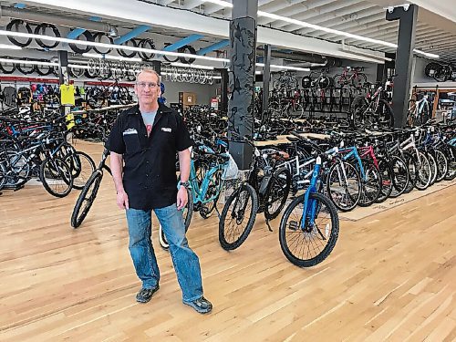 Canstar Community News Philip Roadley, owner of Bikes & Beyond (227 Henderson Hwy.), has made a lot of changes to the way the longstanding Elmwood bike shop does business in order to remain open during the ongoing COVID-19 pandemic. (SHELDON BIRNIE/CANSTAR/THE HERALD)