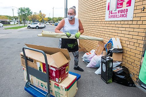 MIKAELA MACKENZIE / WINNIPEG FREE PRESS

Receiver Alison Seavers loads donations into a shipping container, where they will be quarantined, at the Mission Thrift Store in Winnipeg on Wednesday, Sept. 23, 2020.  For Frances Koncan story.

Winnipeg Free Press 2020