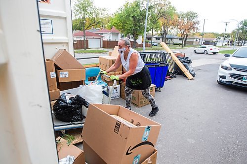 MIKAELA MACKENZIE / WINNIPEG FREE PRESS

Receiver Alison Seavers loads donations into a shipping container, where they will be quarantined, at the Mission Thrift Store in Winnipeg on Wednesday, Sept. 23, 2020.  For Frances Koncan story.

Winnipeg Free Press 2020