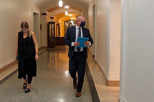 MIKE DEAL / WINNIPEG FREE PRESS
Dr. Brent Roussin, chief provincial public health officer, walks down a hallway in the Manitoba legislative building after his COVID-19 update press conference. He announced that the Winnipeg Metropolitan Region will be going to the Pandemic Response System level, Restricted (Orange), on Monday, September 28.
200925 - Friday, September 25, 2020.