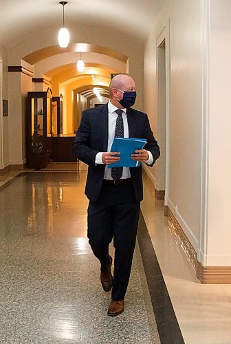 MIKE DEAL / WINNIPEG FREE PRESS
Dr. Brent Roussin, chief provincial public health officer, walks down a hallway in the Manitoba legislative building after his COVID-19 update press conference. He announced that the Winnipeg Metropolitan Region will be going to the Pandemic Response System level, Restricted (Orange), on Monday, September 28.
200925 - Friday, September 25, 2020.