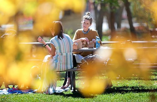 RUTH BONNEVILLE / WINNIPEG FREE PRESS

Standup - Lunch in the Park

Close friends, Erika Sammons (looking at camera, hair up), and Lindsay Bronson, with her 11-month-old daughter, Alice,  enjoy their takeout lunch from Chibo's  at a picnic table in Steven Juba Park amidst an array of fall colours Friday.  


Sept 25th,, 2020